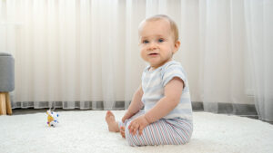 Baby sitting on freshly cleaned carpet
